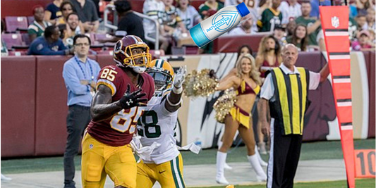Football player leaping to catch a pass near the sideline with PATH Water aluminum bottle overlaid