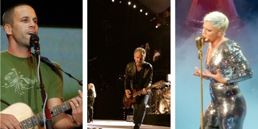 Three musicians performing on stage: an acoustic guitarist, an electric guitarist, and a singer in a sequined jumpsuit under concert lighting