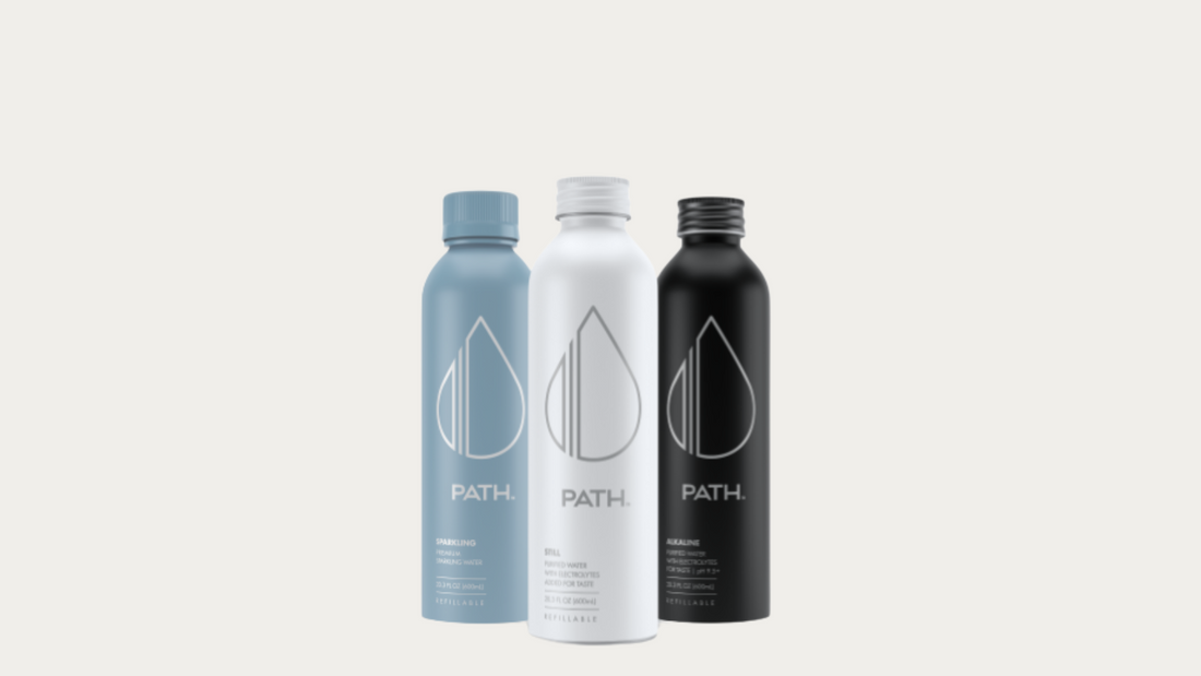 Front view of three PATH aluminum bottles showing PATH logo and matte finish, blue sparkling, white still, and black alkaline on light gray background