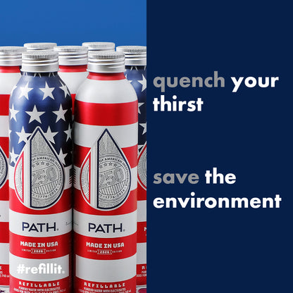Close-up of silver Made in USA 2026 aluminum bottle showing flag design, PATH logo, and navy panel reading quench your thirst